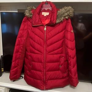 A Michael Kors red winter jacket. Size XL in very good condition.